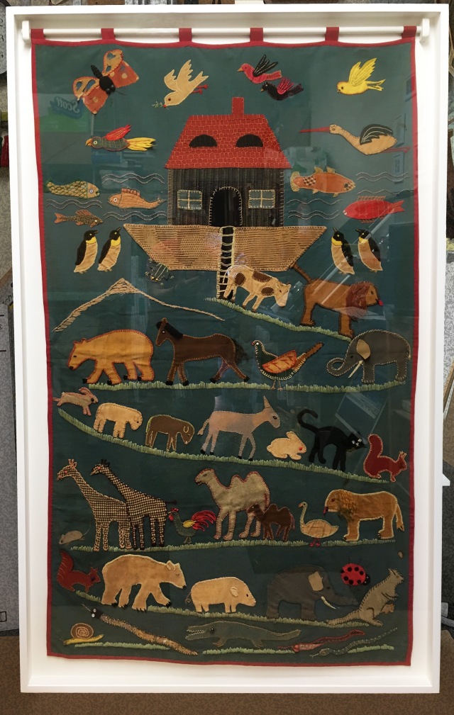 WWII Era "Noah's Ark" Tapestry w/ appliqué. Overall size: 43" w x 70" l x 2.75" d. Shadowbox framing with custom-made bracket.