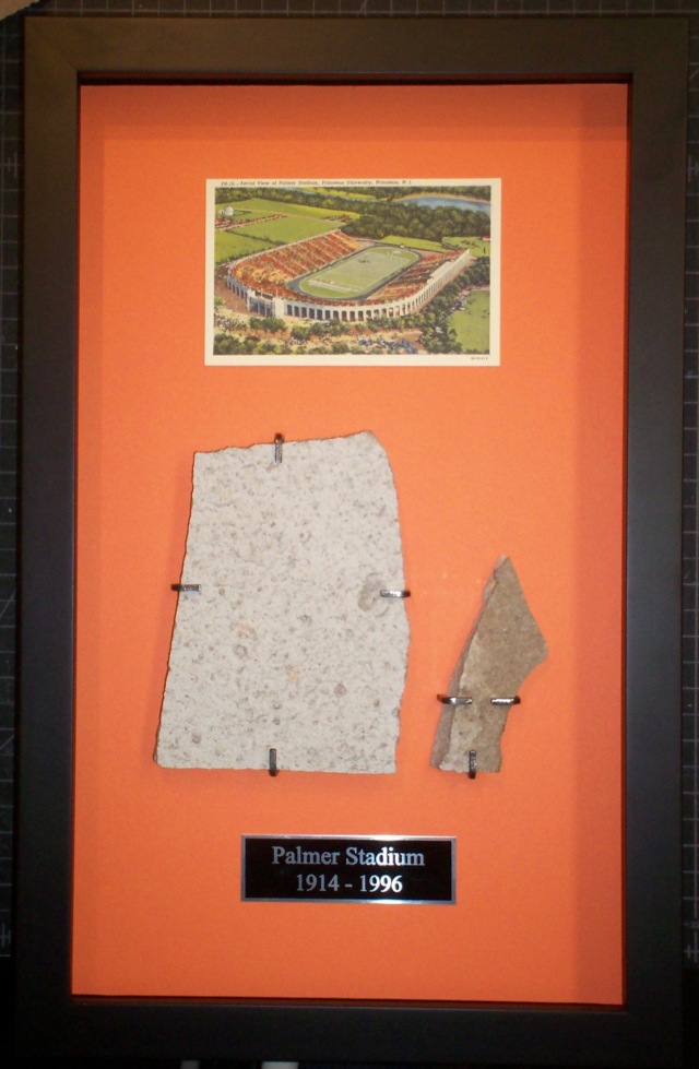 Custom-made brackets for display of fragments from baseball stadium.
